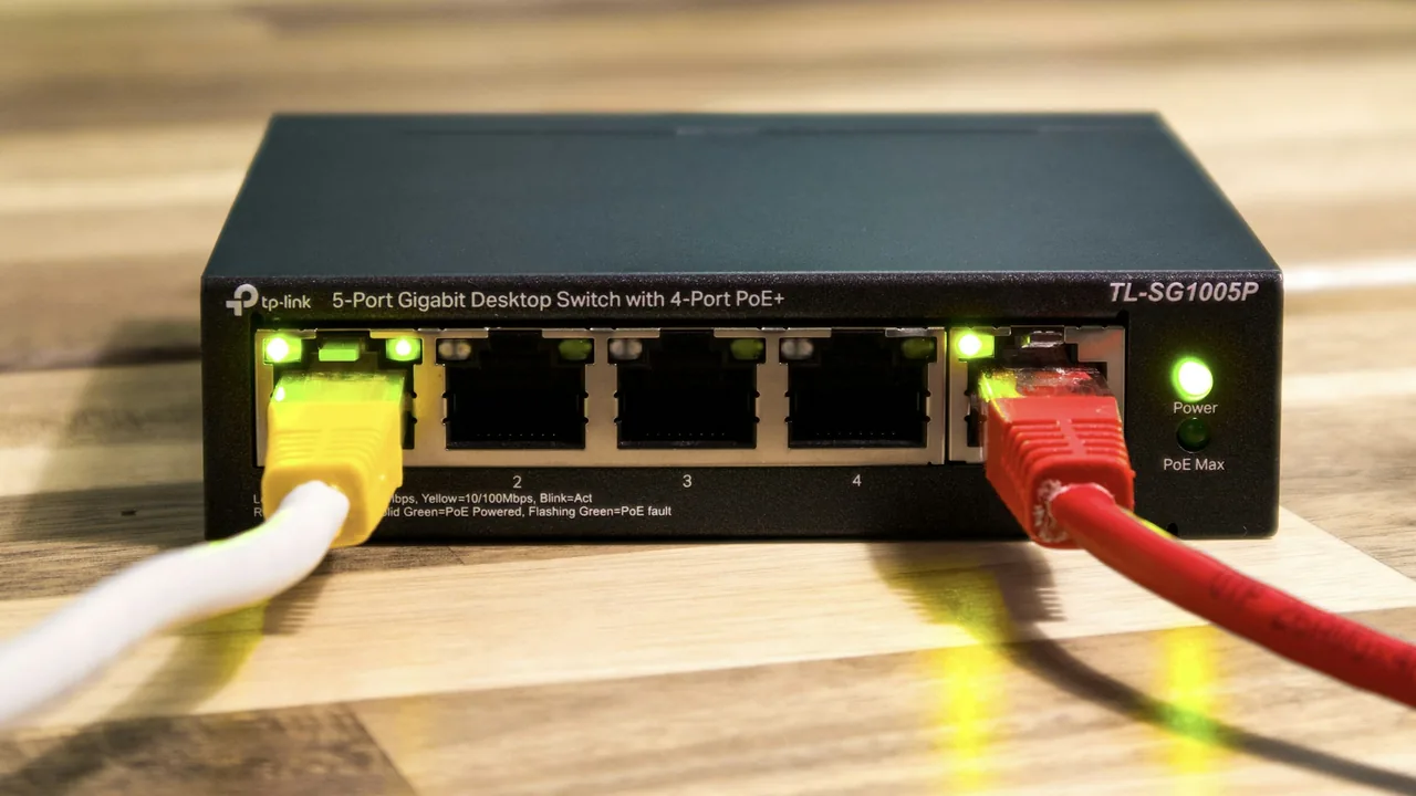 Ethernet cables plugged into a desktop network switch