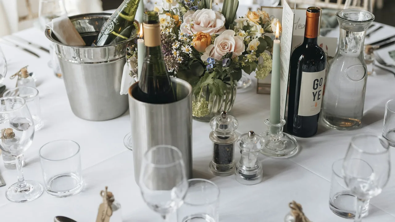 Wedding reception table with flowers and place settings